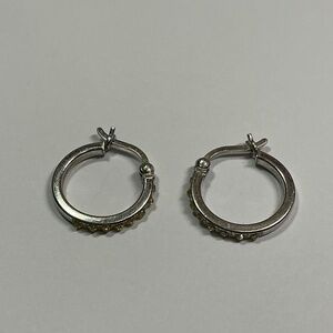 Sterling Silver hoop earrings with yellow gemstones. 5/8 inch diameter